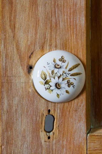 antique flowered doorknob wooden cabinet